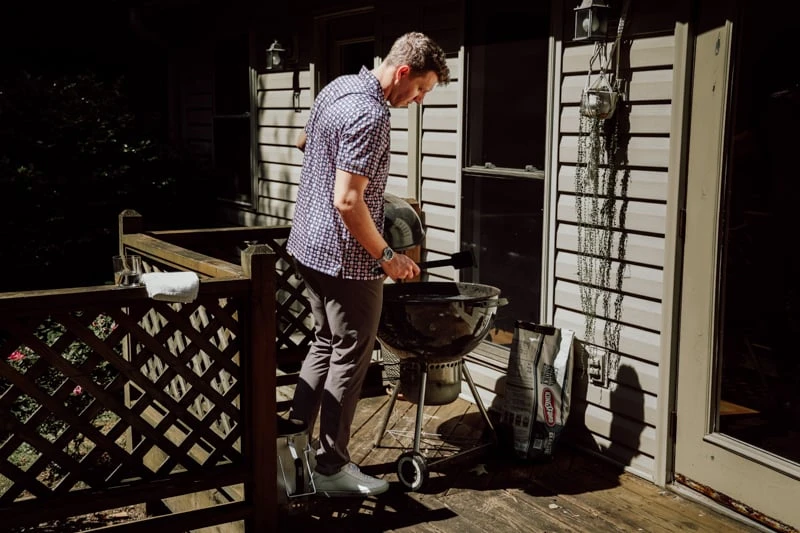 mizzen main model grilling wearing summer polo