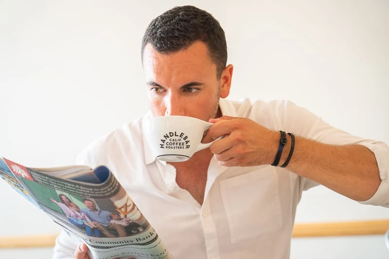 Model sips coffee wearing Pig Hen