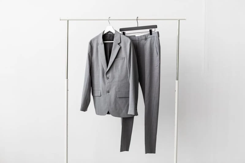 Bluffworks Presidio Blazer and Pants on hangers on white background