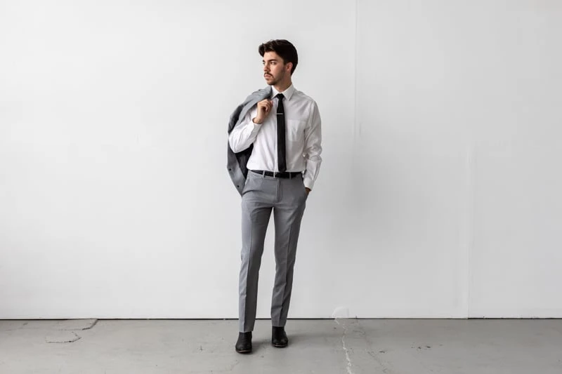 Bluffworks Presidio Blazer and Pants with jacket slung over shoulder