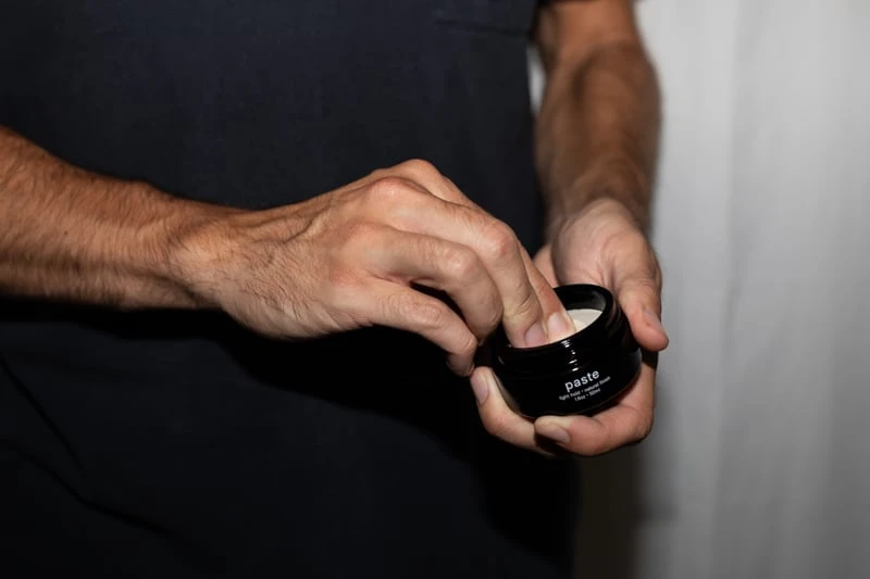 Jack Henry Paste scooping product out of jar