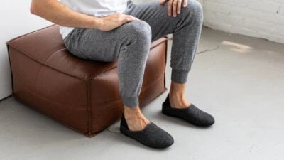 Mahabis Review Model Wearing Mahabis Classic Whiel Sitting on Ottoman