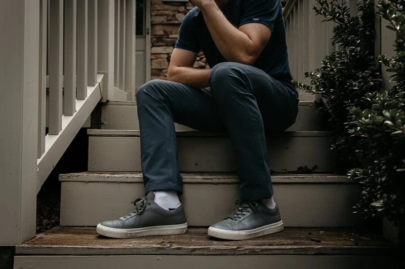 GREATS The Royale Review: My Thoughts After 2 Years of Wear 47 model wearing Greats sitting