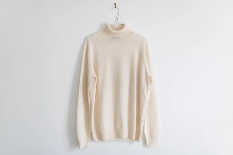 Gobi Cashmere Review: I Tried Their Most Popular Styles 65 Gobi Cashmere basic turtle neck sweater on hanger on white background