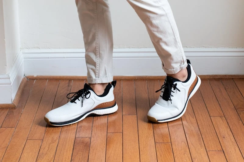 Johnston and Murphy XC4 H1 Luxe Hybrid golf shoes being worn with white pants from side