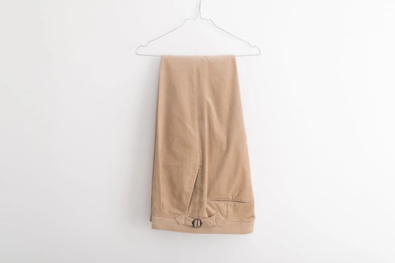 Suitsupply Custom Suit pants hanging on hanger