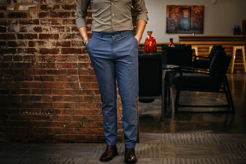 mang wearing grey pants and brown shoes