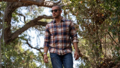 Flag and Anthem Review Model Wearing FLag and Anthem Flannel and Jeans Outdoors