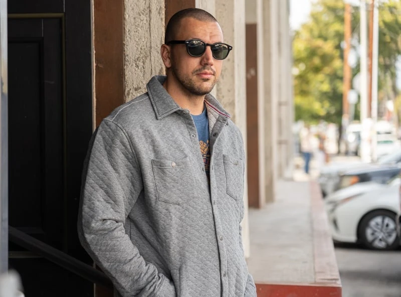 Model in grey quilted Flag Anthem jacket