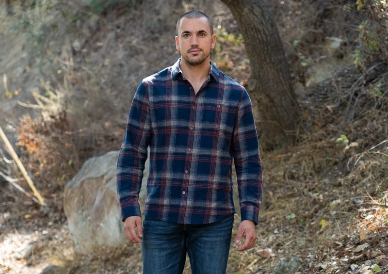 Model in woods in Flag Anthem flannel