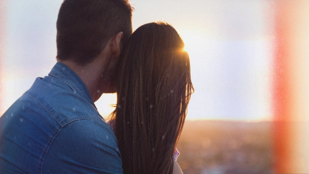 The Adult Man How to Be More Dominant in a Relationship as a Man (The Right Way) Couple Embracing Each Other While Looking at Sunset