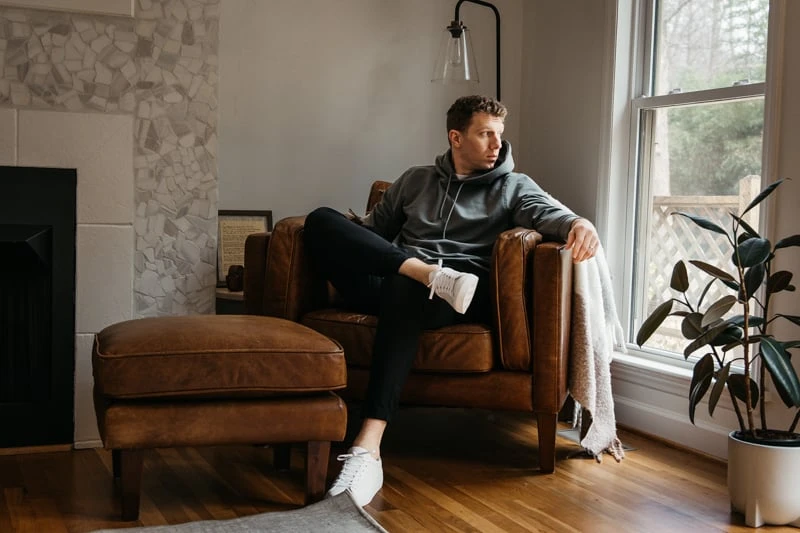 Cuts Clothing Review: I Tried Their Most Popular Styles 54 Cuts hoodie on model in chair