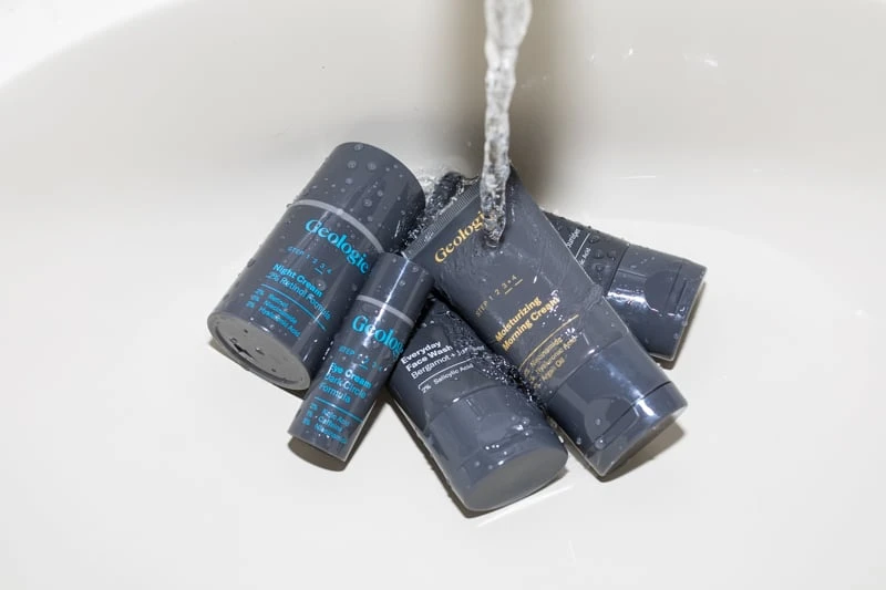 Geologie skincare set in sink with updated packaging