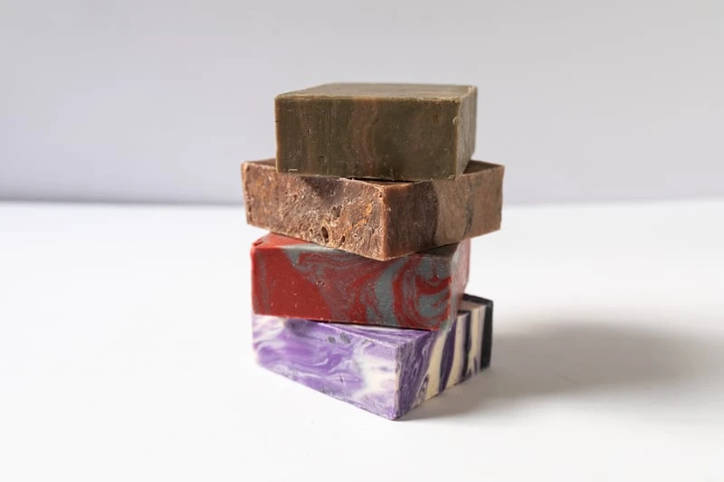 Dapper Yankee Review: Natural Soaps That Are Not Like the Others 59 Dapper Yankee Bar Soaps stacked on white background