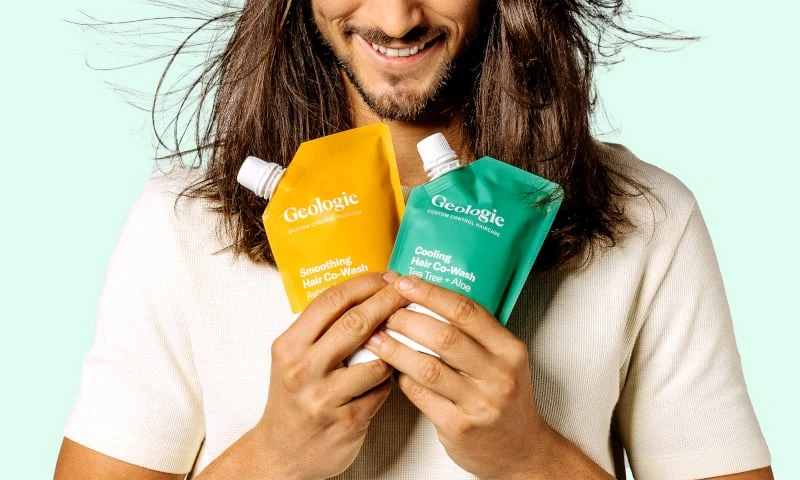 Man Holding Geologie Smoothing and Cooling Hair Co Washes