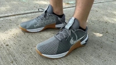 2023/05/Nike-Metcon-8-Review-Model-Wearing-Metcon-8s-outside-on-pavement.jpgw3.webp