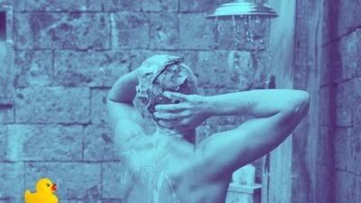 2023/05/The-Adult-Man-Our-Go-To-Hair-Care-Routine-for-Men-This-Will-Make-You-Look-Healthier-Man-in-SHower-with-Rubber-Duck.jpgw3.webp