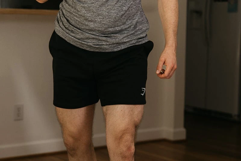 Gymshark crest shorts on model 1