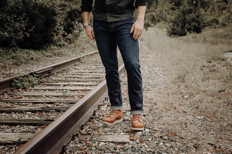 Man wearing jeans and brown shoes