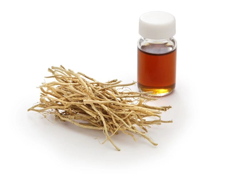 dried vetiver roots vetiver essential oil glass vial fragrance material