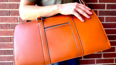 Carl Friedrik Palissy Weekend Bag Review Model Holding the Cognac Palissy