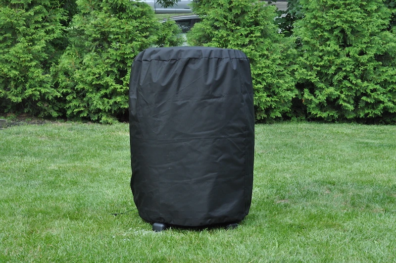 Ice Barrel with cover on in backyard