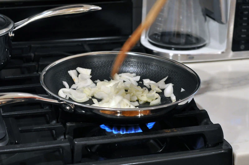 18 Best Cooking Gifts for Men: These Will Earn You an Epic Meal 42 Sauteed onions cooking in HexClad pan on stove