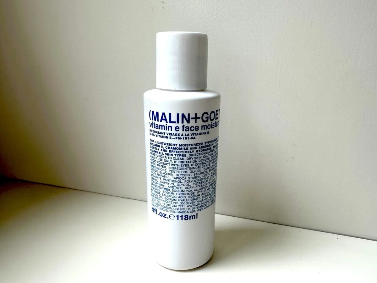 MalinGoetz skincare vitamin e moisturizer behind white background