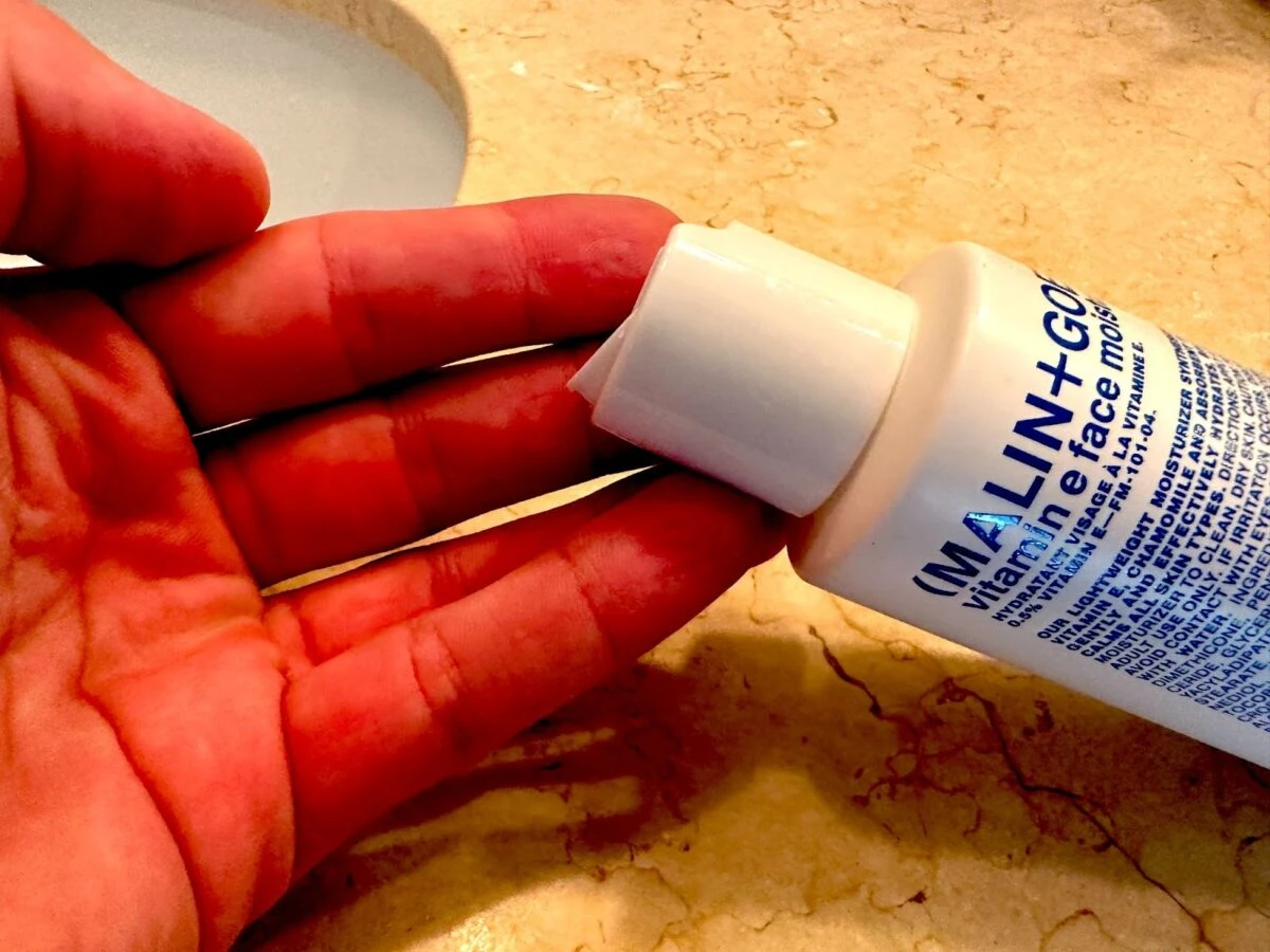 MalinGoetz skincare vitamin e moisturizer on hand