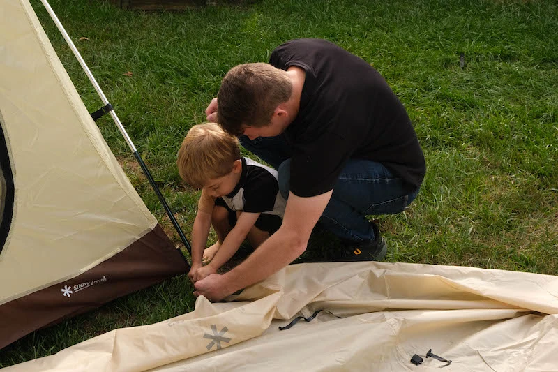Snow Peak Alpha Breeze tent putting stake in ground