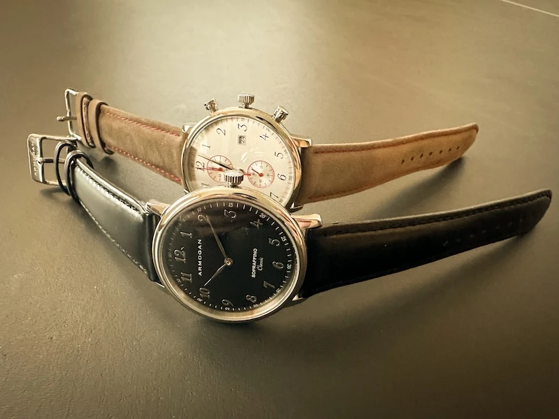 Armogan Watches laid out on table in back