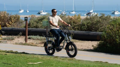 Best ebikes Under 2000 Me Riding the Rad Power Bikes RadRunner Plus on a seaside pathway