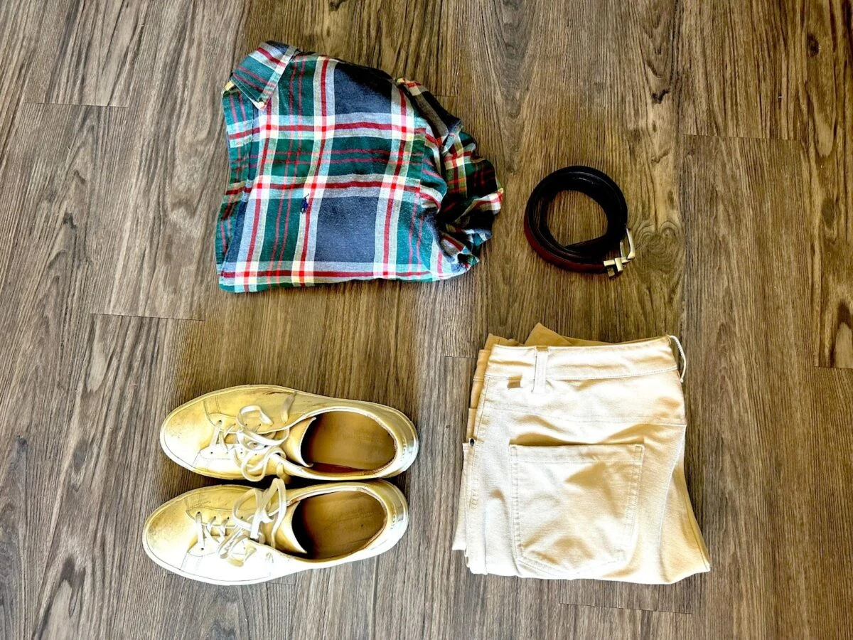 Capsule wardrobe laid out with belt