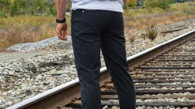 Model Wearing Western Rise AT Pants on Train Tracks