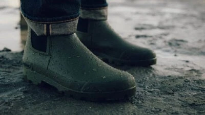 2024/01/Man-standing-in-the-rain-wearing-SeaVees-rain-boots.jpgw3.webp
