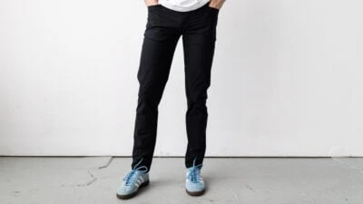 2024/01/Model-Wearing-Black-Vuori-Meta-Pants-and-Blue-Sneakers.jpgw3.webp