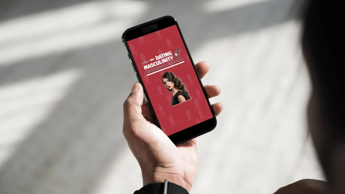 The Adult Man 6 Best Dating Courses for Men According to a Dating Coach Man Using Phone with Dating & Masculinity Course on Screen