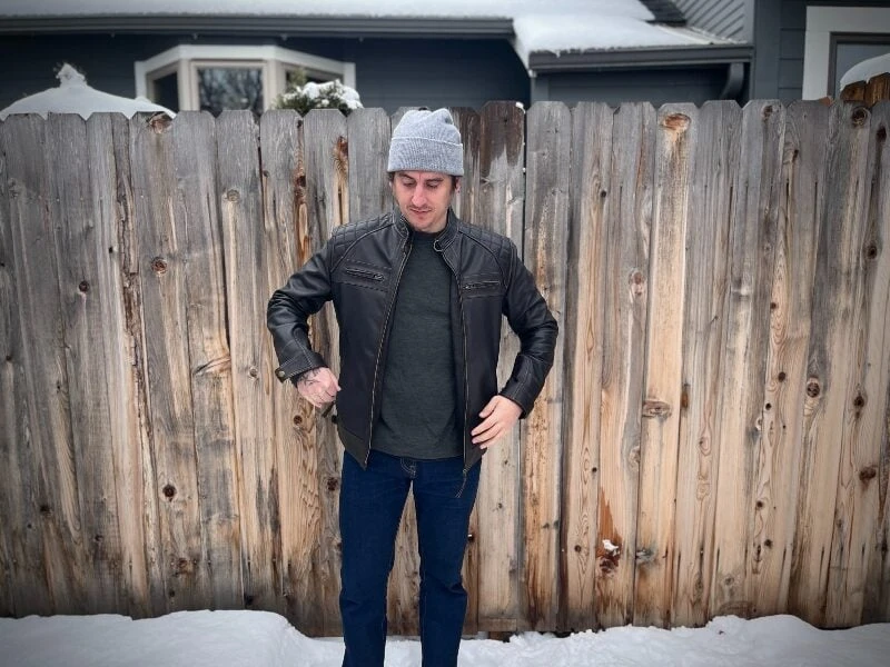 The Adult Man Angel Jackets Cafe Racer Man Standing In Snow by Fence 800 e1706199066530