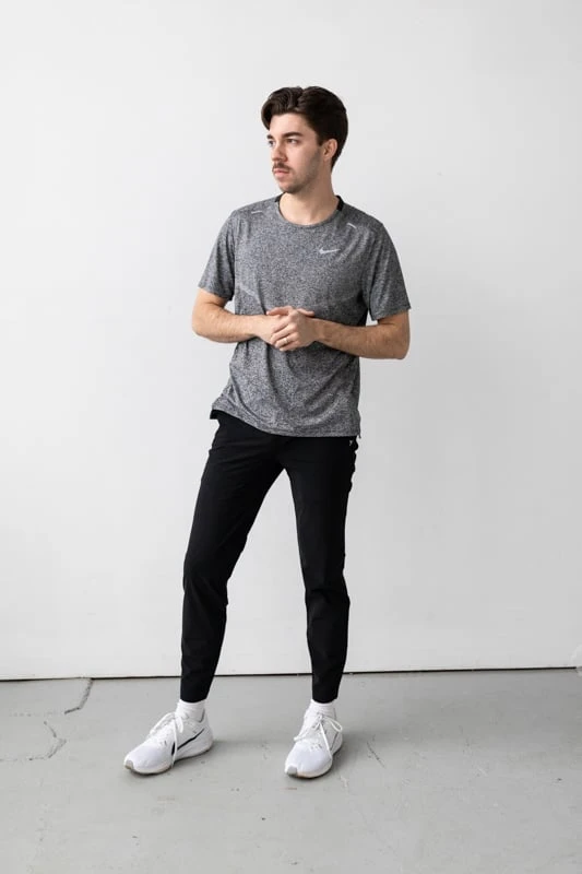 Vuori Fleet Pant with running shoes and shirt