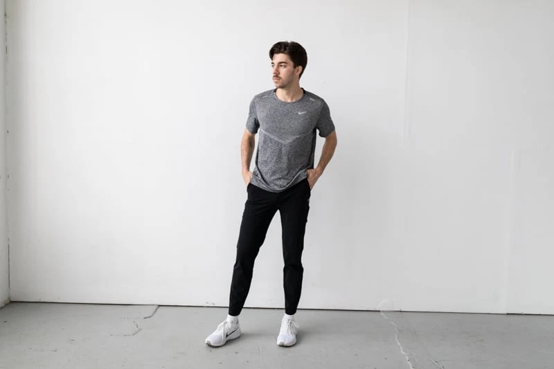 Vuori Fleet Pants with white shoes and gray running shirt