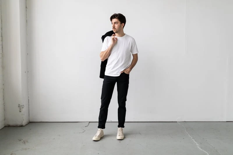 Vuori Meta Pant with chucks and a jacket from front