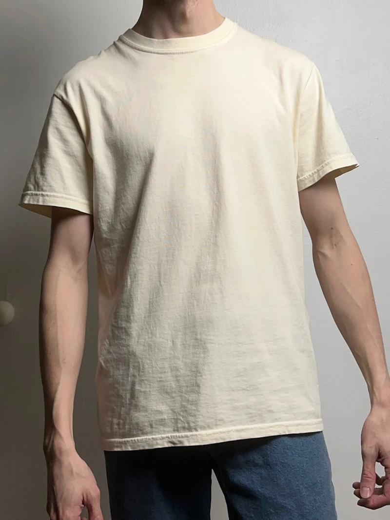 A male model in a laid-back, loose-fitting t-shirt