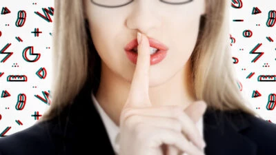 Attractive business woman doing silence sign on abstract background