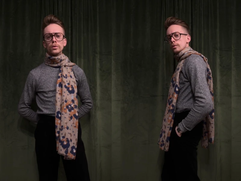 model wearing a scarf around his neck