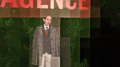 Karlton getting his picture taken at an event pixelated