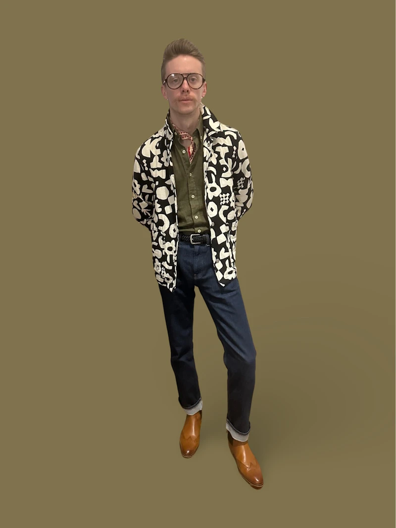 Model Posing wearing Green shirt and Dark blue jeans