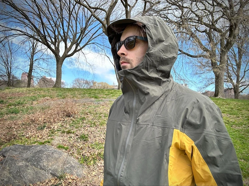 Model Wearing One Shell with Hood Drawn