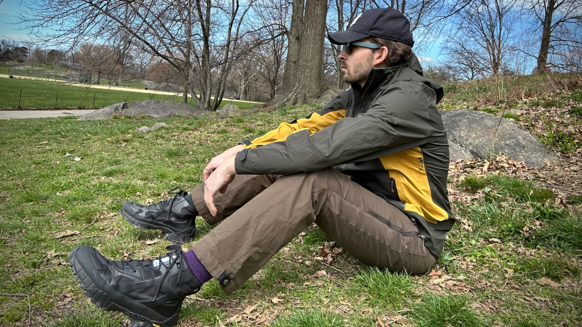 Model wearing Kuhl One Shell and Renegade Pants in park in NYC