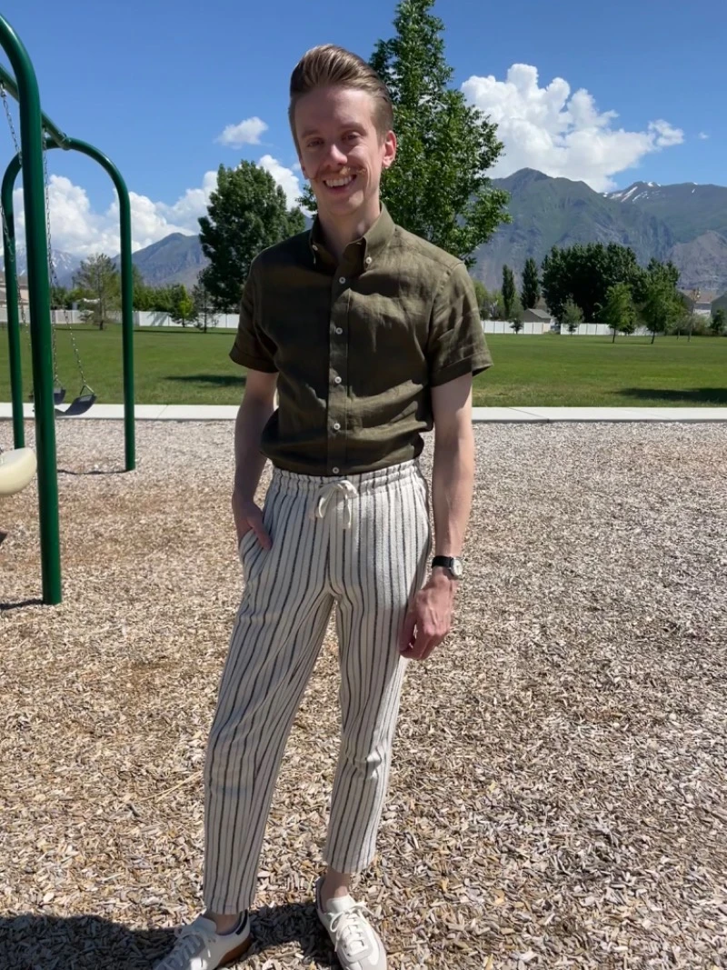 Photo of Model Wearing Green Button Down Shirt wiht Striped Bottoms