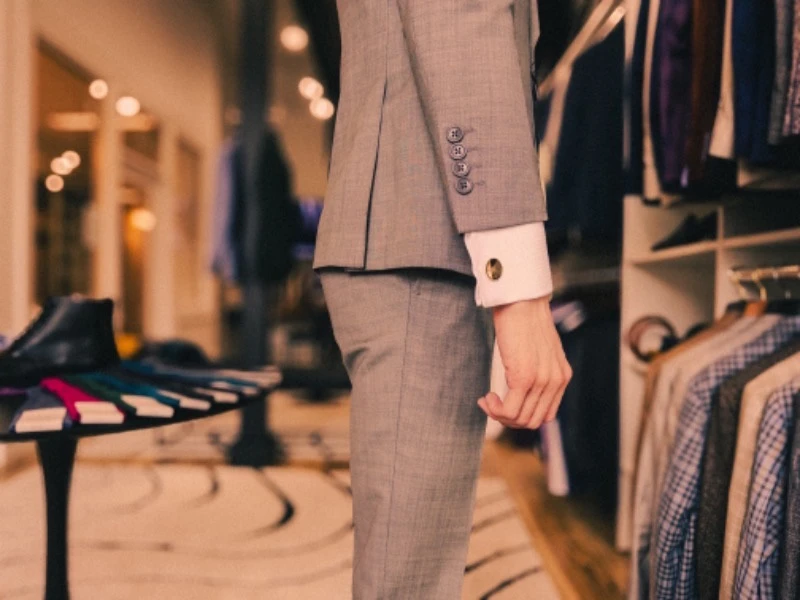 Photo of Right Side View of Model Wearing Grey Suit